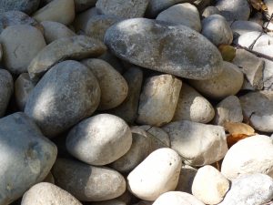 River stones are visually appealing, but still require maintenance